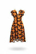 Load image into Gallery viewer, A short-sleeve V-neck dress with a black background and an all-over orange jack-o'-lantern pattern, shown on a white background with a soft drop shadow.
