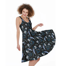 Load image into Gallery viewer, A woman wearing a sleeveless black midi dress with a repeating gothic pattern of skulls, bows, and crescent moons, captured mid-spin to show the skirt's movement against a plain white background.
