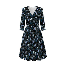 Load image into Gallery viewer, A black V-neck midi dress with three-quarter sleeves, featuring an all-over print of grim reaper figures, skulls, and scythe blades in dark blue, white, and gray, shown against a light gray gradient background.
