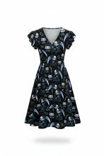 Load image into Gallery viewer, A black V-neck swing dress with ruffled cap sleeves, featuring an all-over print of cartoon Grim Reaper characters with blue moons and white stars, shown on a plain white background.

