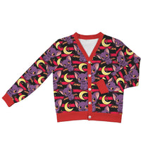 Load image into Gallery viewer, A long-sleeve cardigan sweater with a blue and gray geometric pattern, accented with red trim on the collar, cuffs, hem, and button placket, shown on a plain white background.
